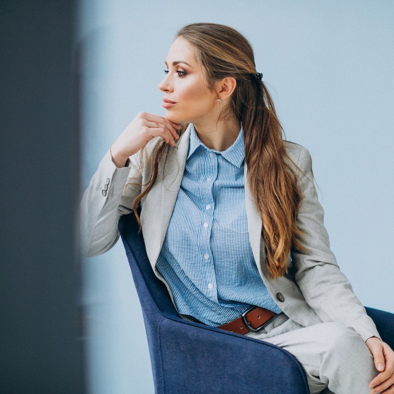 businesswoman-sitting-chair-office