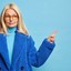 serious-blonde-forty-years-old-caucasian-woman-has-curious-expression-indicates-away-blank-space-wears-optical-glasses-stylish-fur-coat