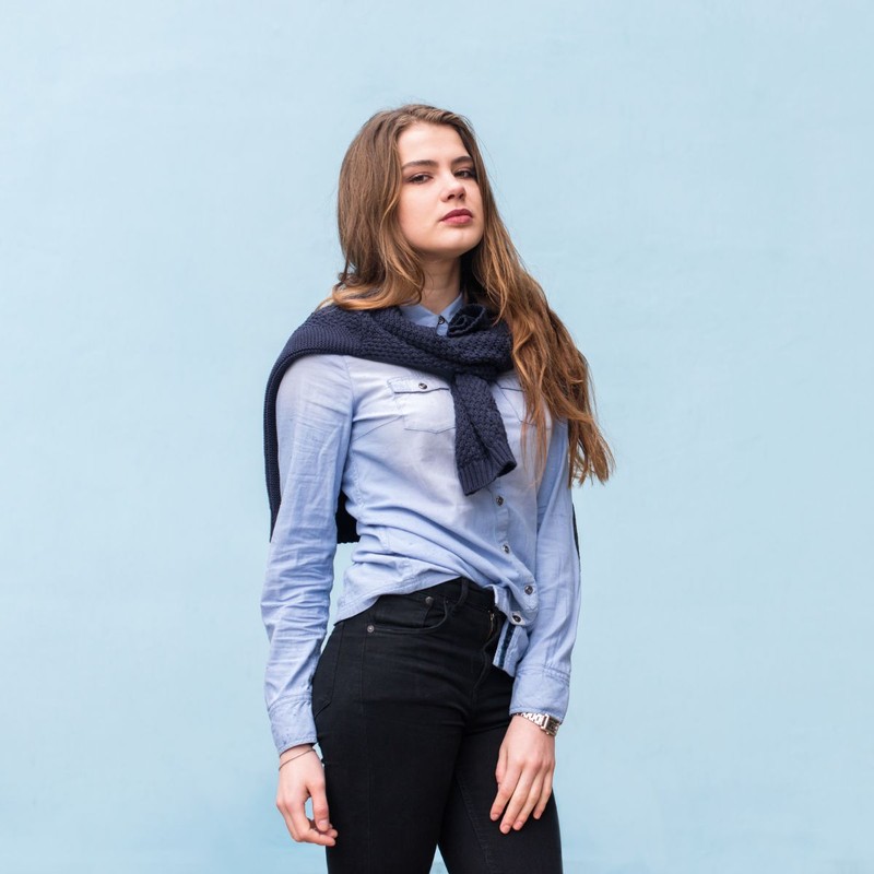 very-beautiful-girl-background-blue-wall