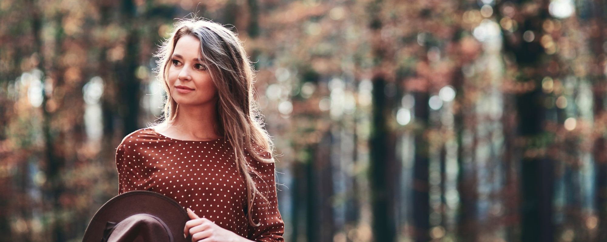 woman-walking-autumnal-forest